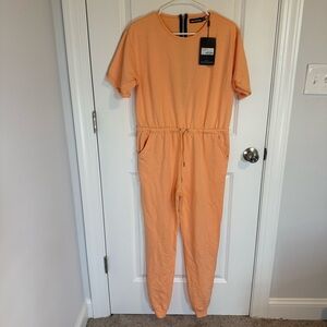 Pretty Little Things Peach Short Sleeve Jump Suit Timber Size 8